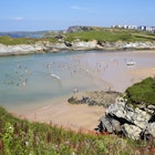 Tourists, swimmers and holidaymakers at Lusty Glaze Beach along the Cornish Coastline